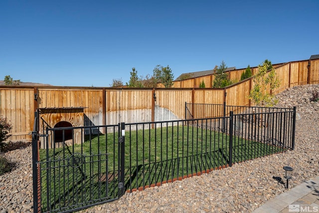 view of yard featuring a fenced backyard