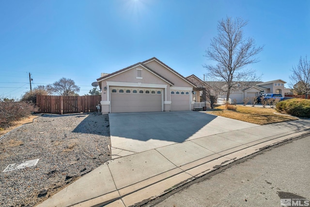 ranch-style house with a garage, fence, concrete driveway, and stucco siding