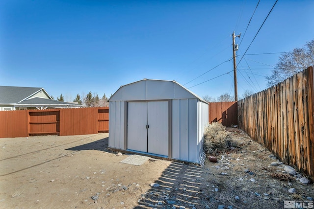 view of shed featuring a fenced backyard