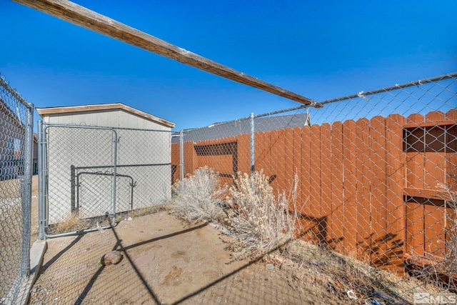 view of yard with fence and a gate