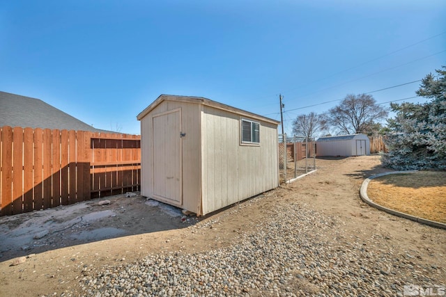 view of shed featuring a fenced backyard