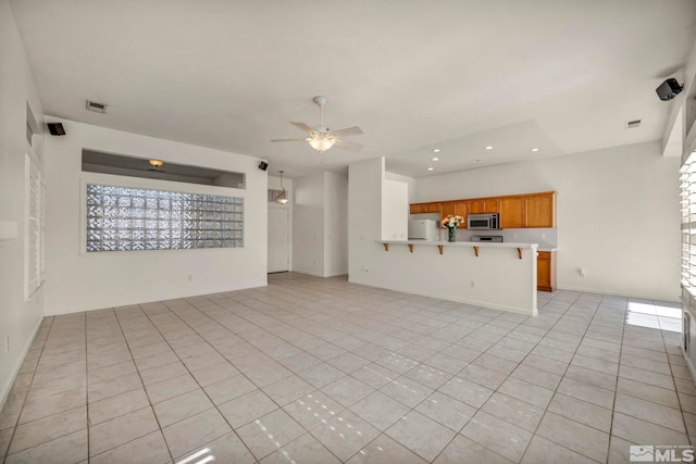 unfurnished living room featuring ceiling fan, light tile patterned floors, visible vents, and recessed lighting