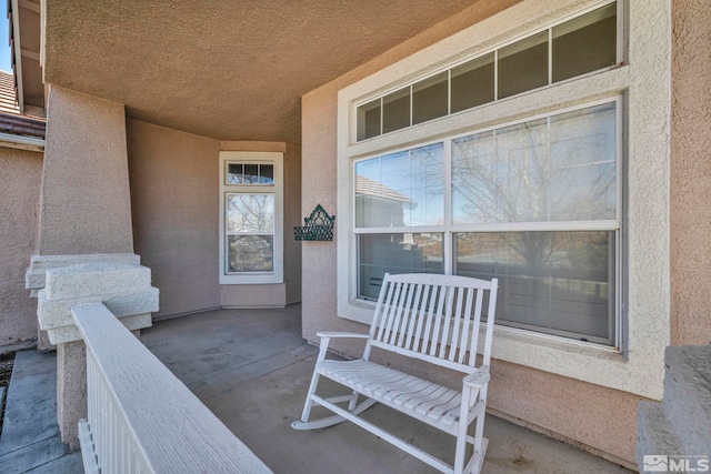 doorway to property with stucco siding