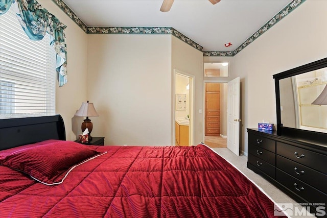 bedroom with light carpet and a ceiling fan