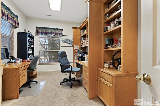 office featuring light carpet and visible vents