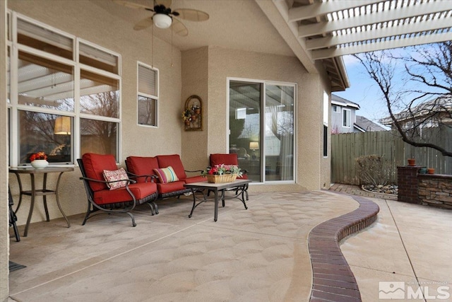 view of patio featuring fence, a ceiling fan, and a pergola