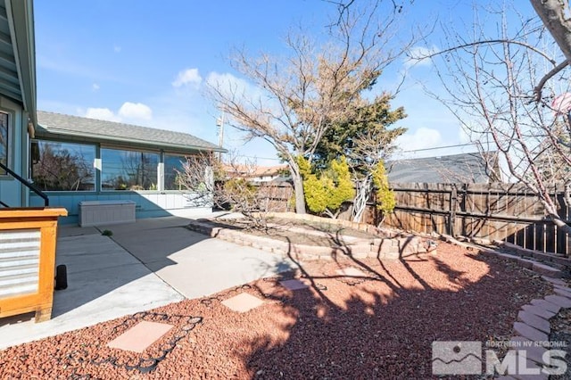 view of yard with a patio area and fence