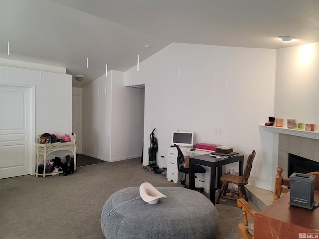 interior space with carpet floors and vaulted ceiling