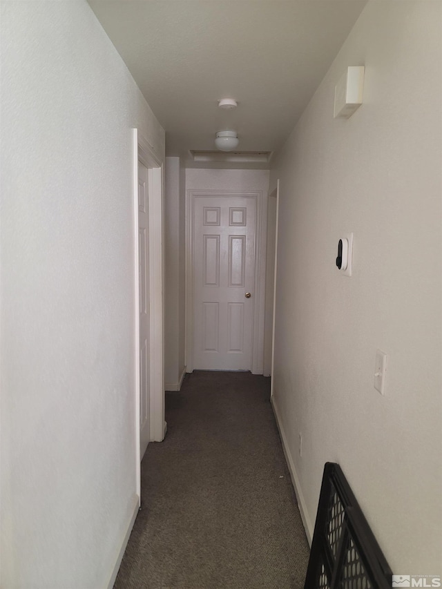 hall with carpet and baseboards