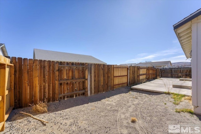 view of yard featuring a patio and a fenced backyard