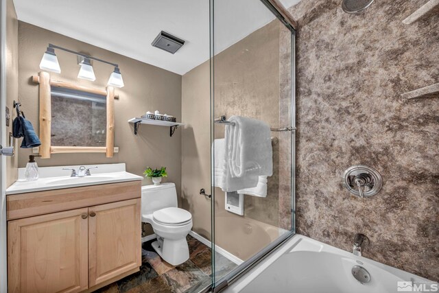 bathroom with toilet, vanity, and bathing tub / shower combination