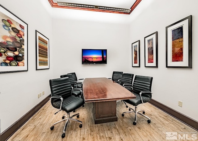 home office featuring wood-type flooring and baseboards