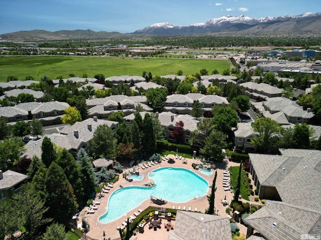 birds eye view of property with a mountain view