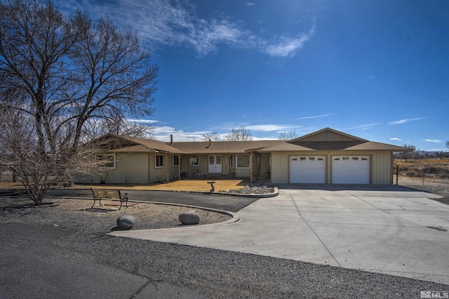 single story home featuring a garage and driveway