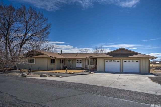 ranch-style house with driveway and an attached garage