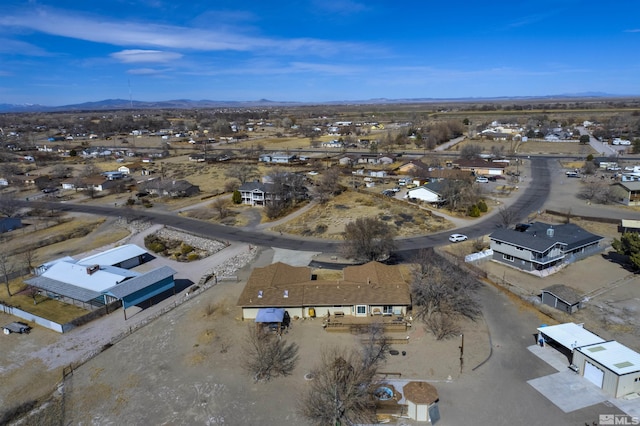 birds eye view of property with a mountain view