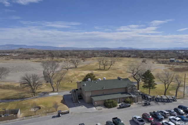 drone / aerial view featuring a mountain view and a rural view