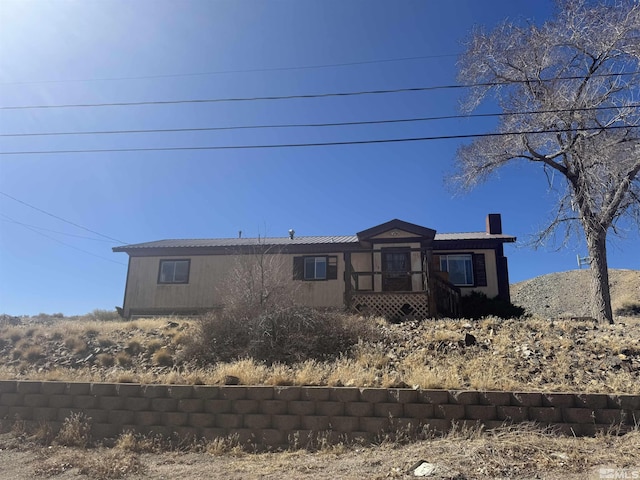 view of front of home with a chimney