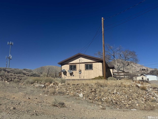 view of home's exterior with a mountain view