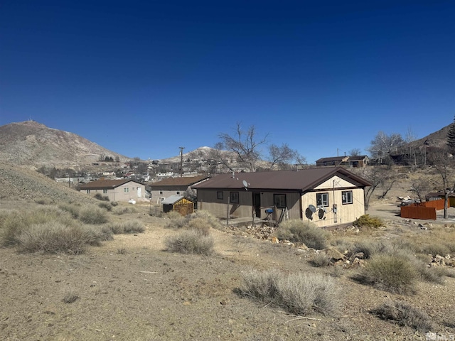 rear view of property with a mountain view