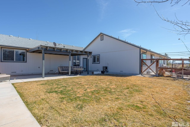 back of house featuring a yard, outdoor lounge area, crawl space, and a patio area