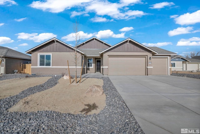 ranch-style house featuring a garage and driveway