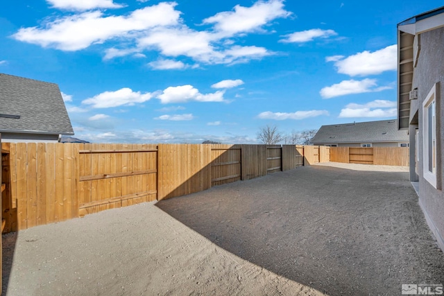 view of yard with a patio area and a fenced backyard