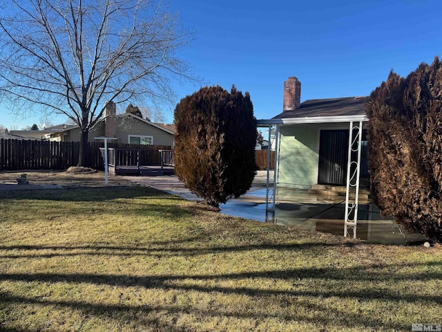 view of yard with a patio and fence