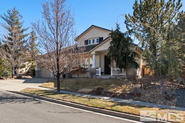 view of front of property featuring covered porch, concrete driveway, a garage, and stucco siding