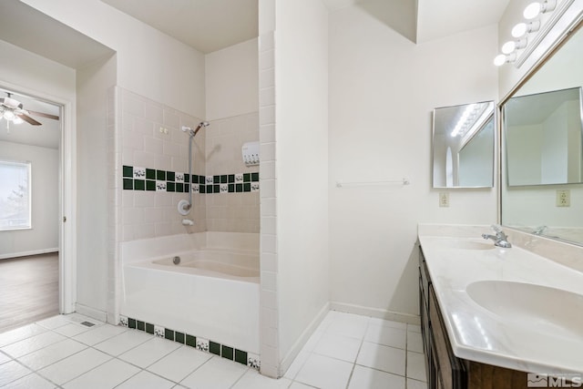 bathroom featuring  shower combination, ceiling fan, a sink, and tile patterned floors