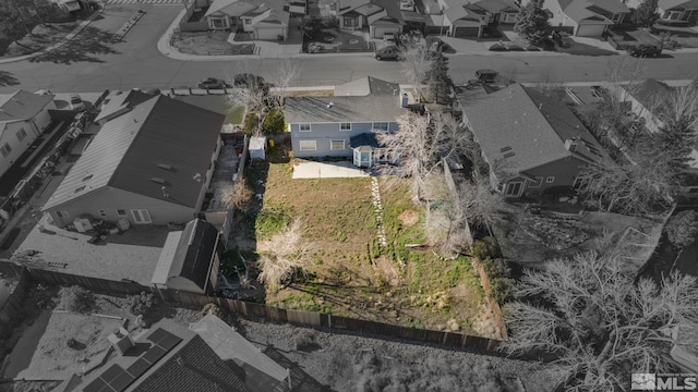 birds eye view of property with a residential view