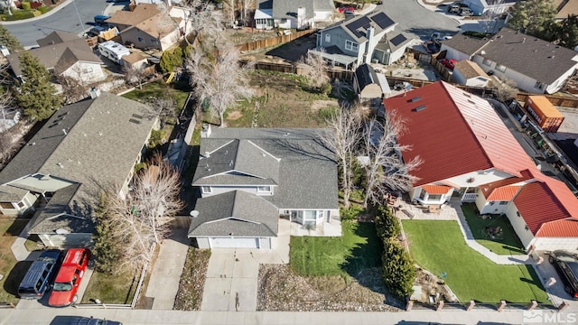 birds eye view of property with a residential view