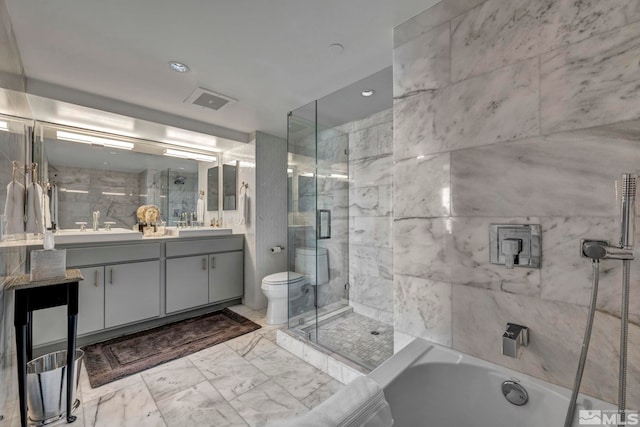 full bath featuring double vanity, a shower stall, a bathtub, and toilet