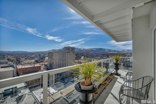balcony with a view of city and a mountain view