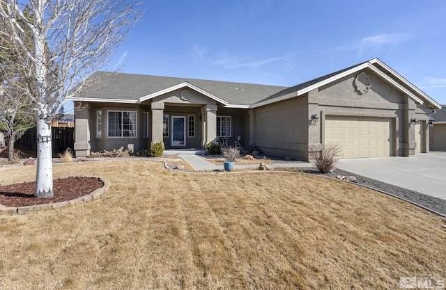 ranch-style house with a garage, a front lawn, concrete driveway, and stucco siding