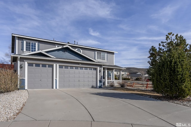 view of front of house with concrete driveway and an attached garage