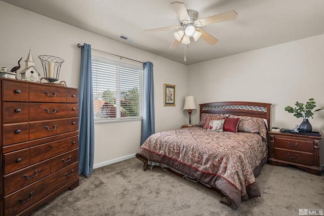 bedroom featuring a ceiling fan, carpet, visible vents, and baseboards