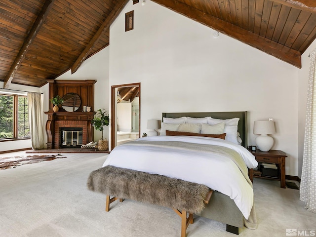 bedroom featuring wooden ceiling, a brick fireplace, beam ceiling, and light colored carpet