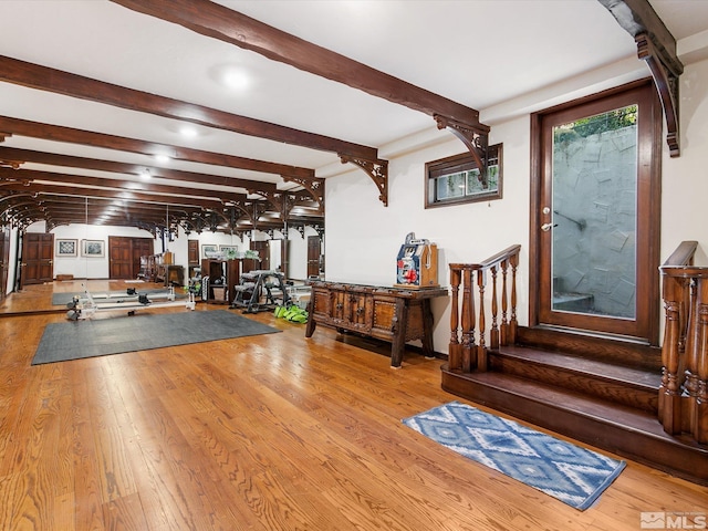 workout area with wood-type flooring