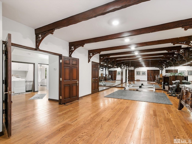 interior space with washer / clothes dryer and light wood finished floors