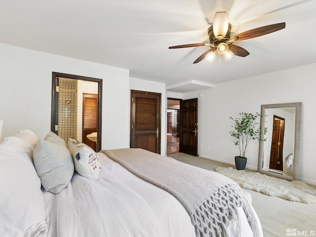 bedroom with carpet, connected bathroom, baseboards, and ceiling fan