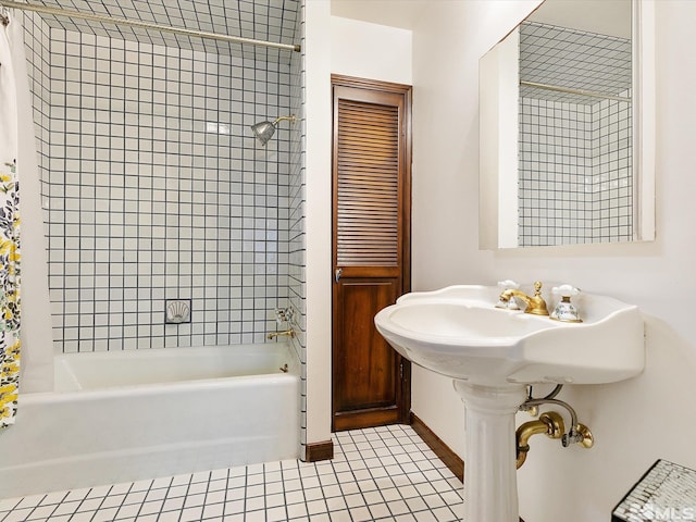 bathroom with tile patterned flooring and bathing tub / shower combination