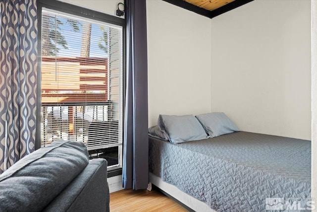 bedroom featuring wood finished floors