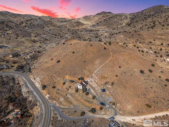 aerial view at dusk with a mountain view