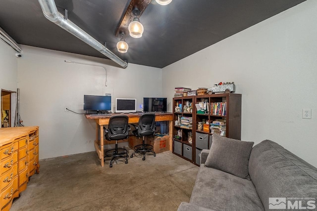 office area featuring concrete floors