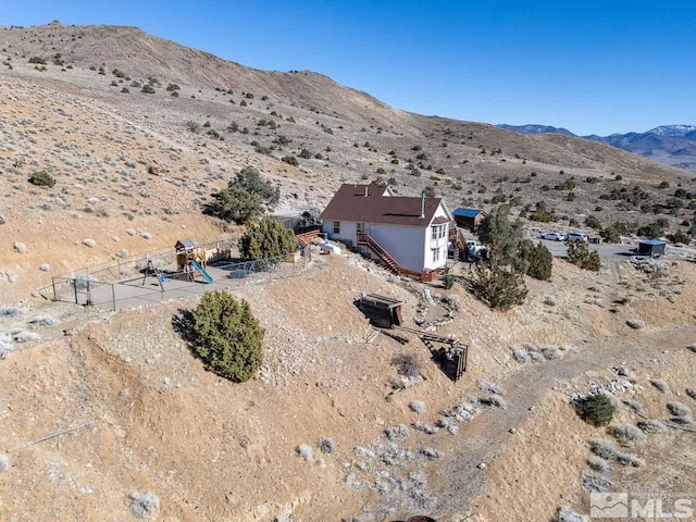 birds eye view of property featuring a mountain view