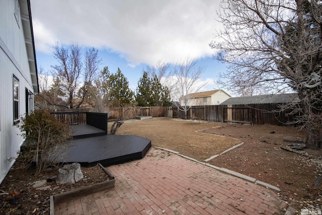 view of yard featuring a patio area and a fenced backyard