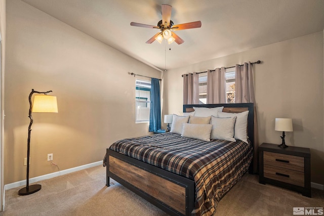 carpeted bedroom with lofted ceiling, ceiling fan, and baseboards