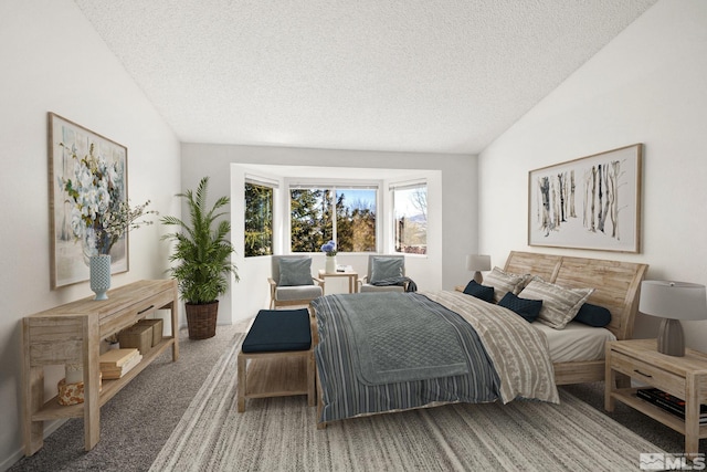 carpeted bedroom with lofted ceiling and a textured ceiling