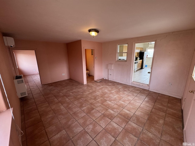 empty room with a wall mounted air conditioner and heating unit